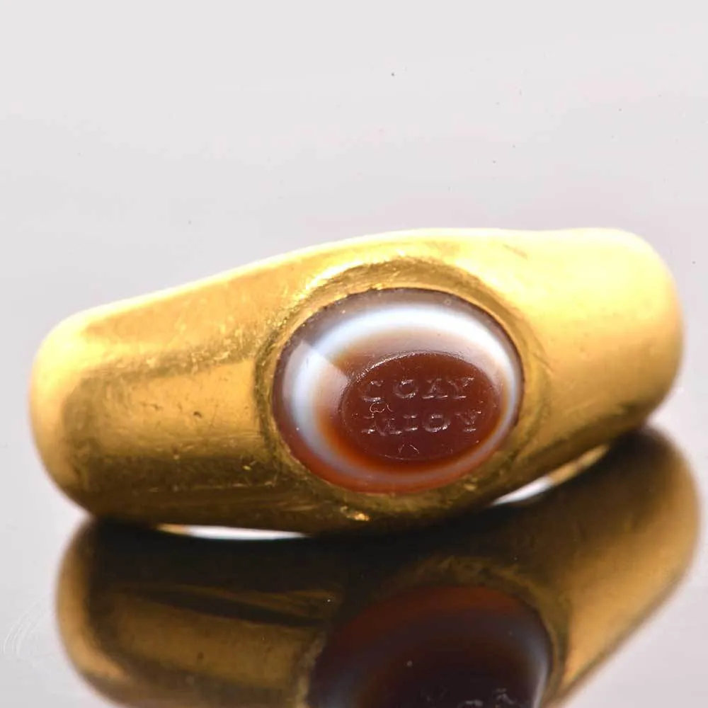 An exhibited Roman Gold and inscribed Eye Agate Finger Ring, ca. 3rd century CE